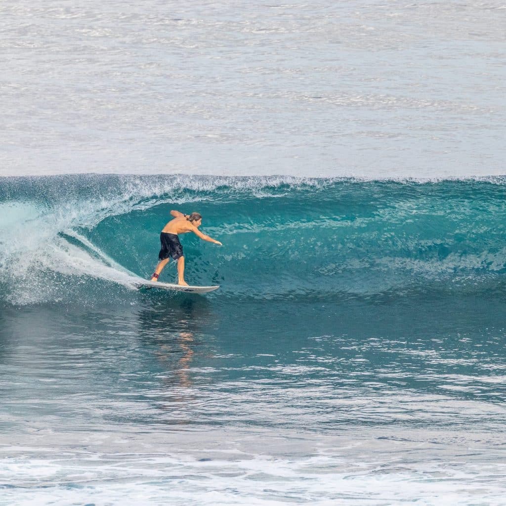 Advanced surfer riding a barrel.
