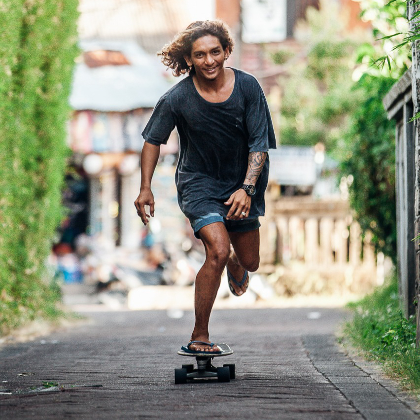 Photo of Samy, an instructor at Padang Padang Surf Camp, skateboarding.