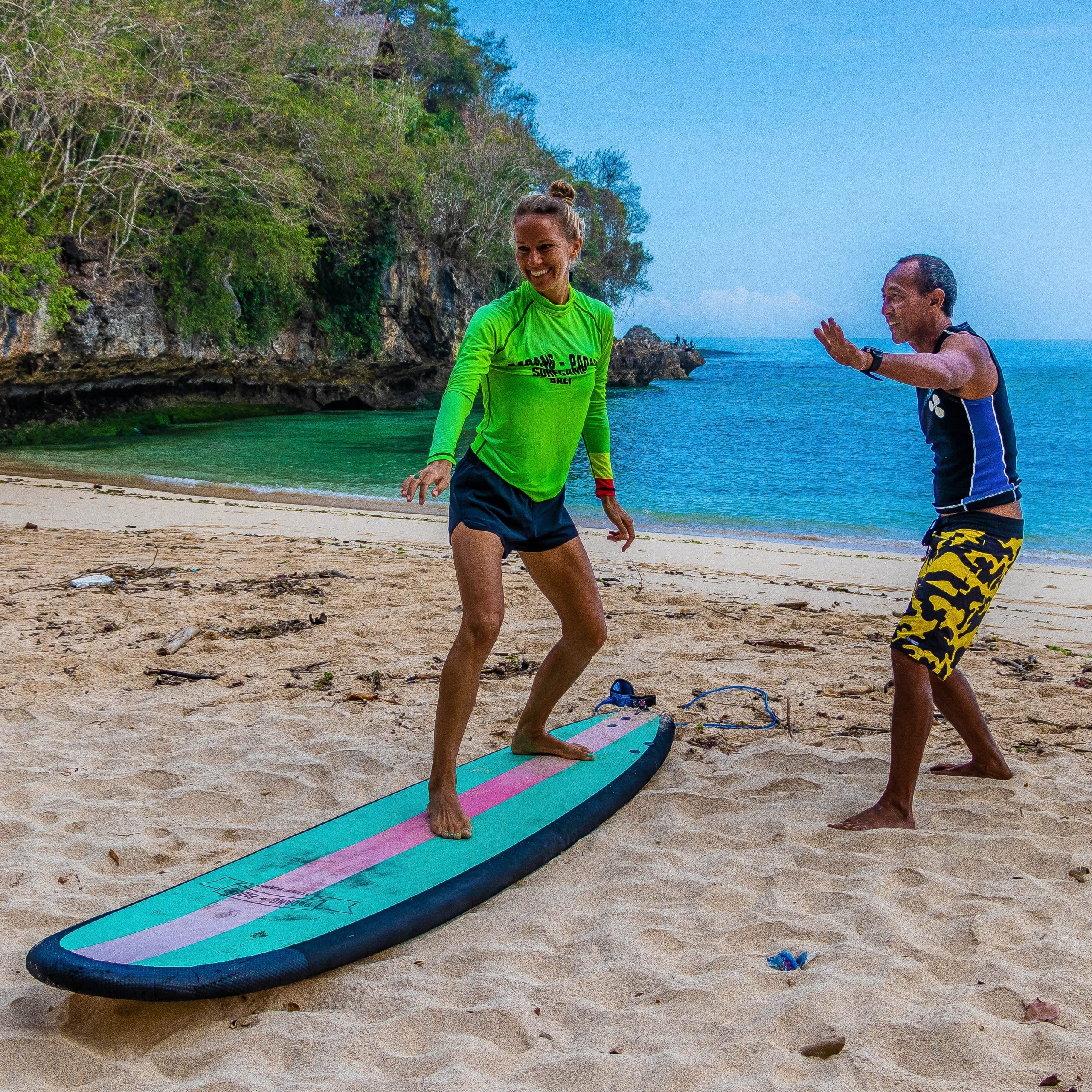Instructor giving a surf lesson.