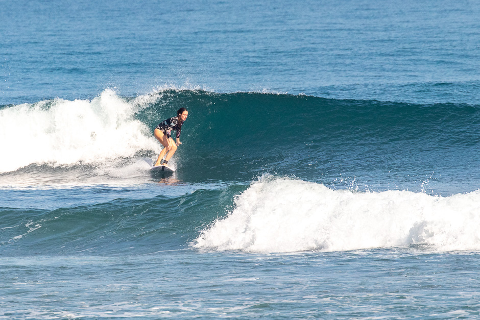 Surfer riding a wave at Balangan.