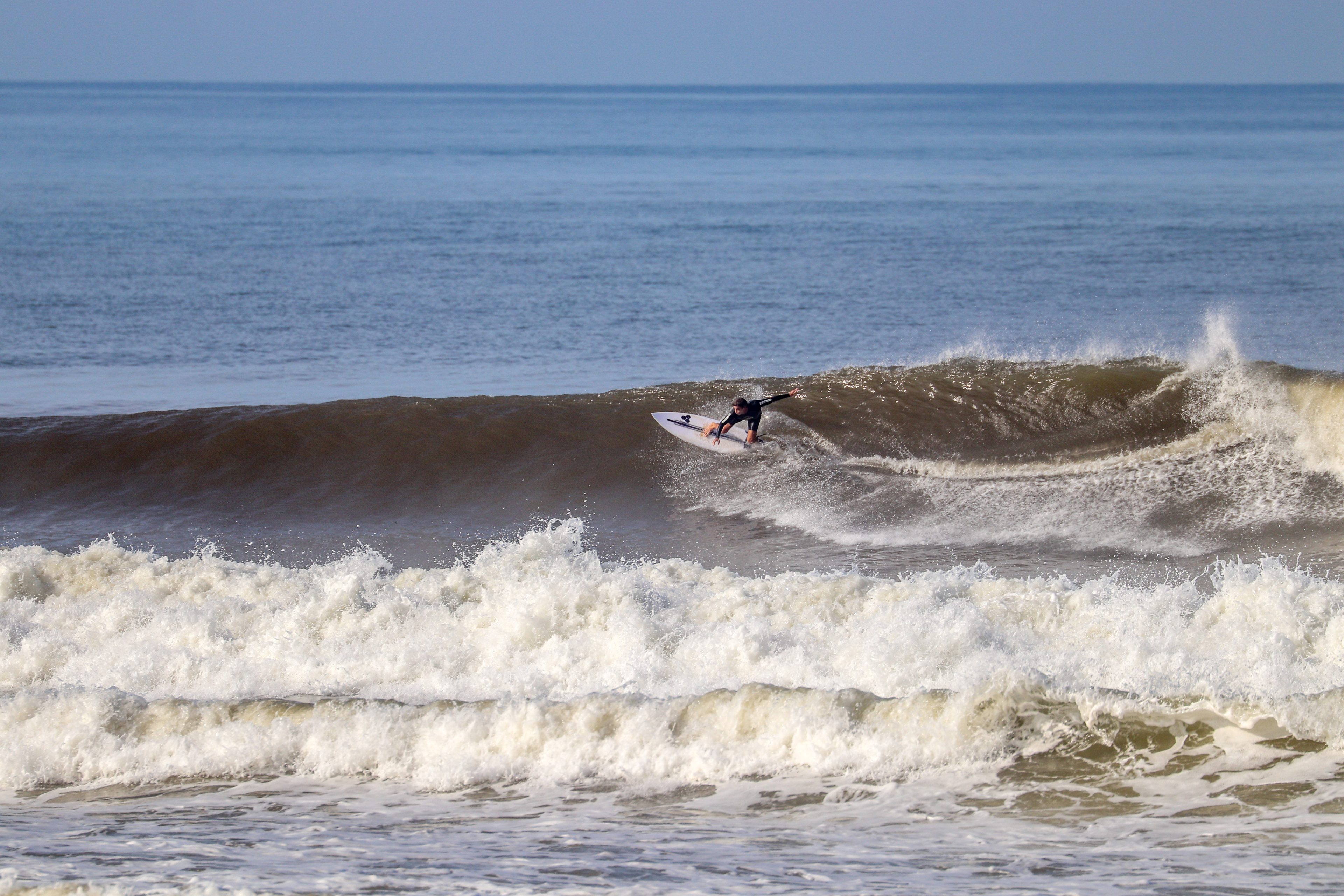 image of a surfer going right at Balian.