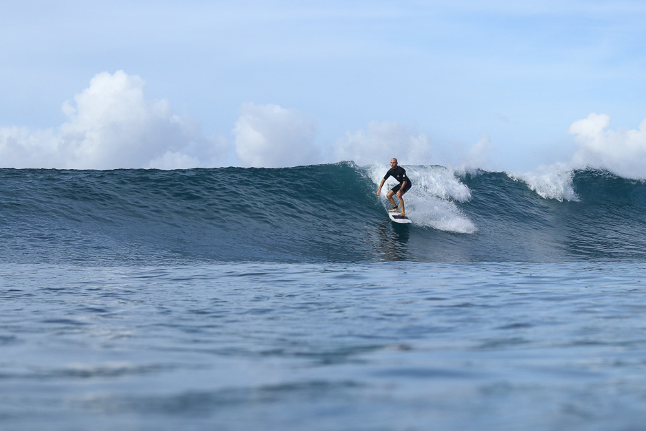 Surfer riding a wave at Chicken Wings.