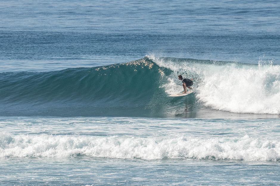Surfer riding a wave at Green Bowl.