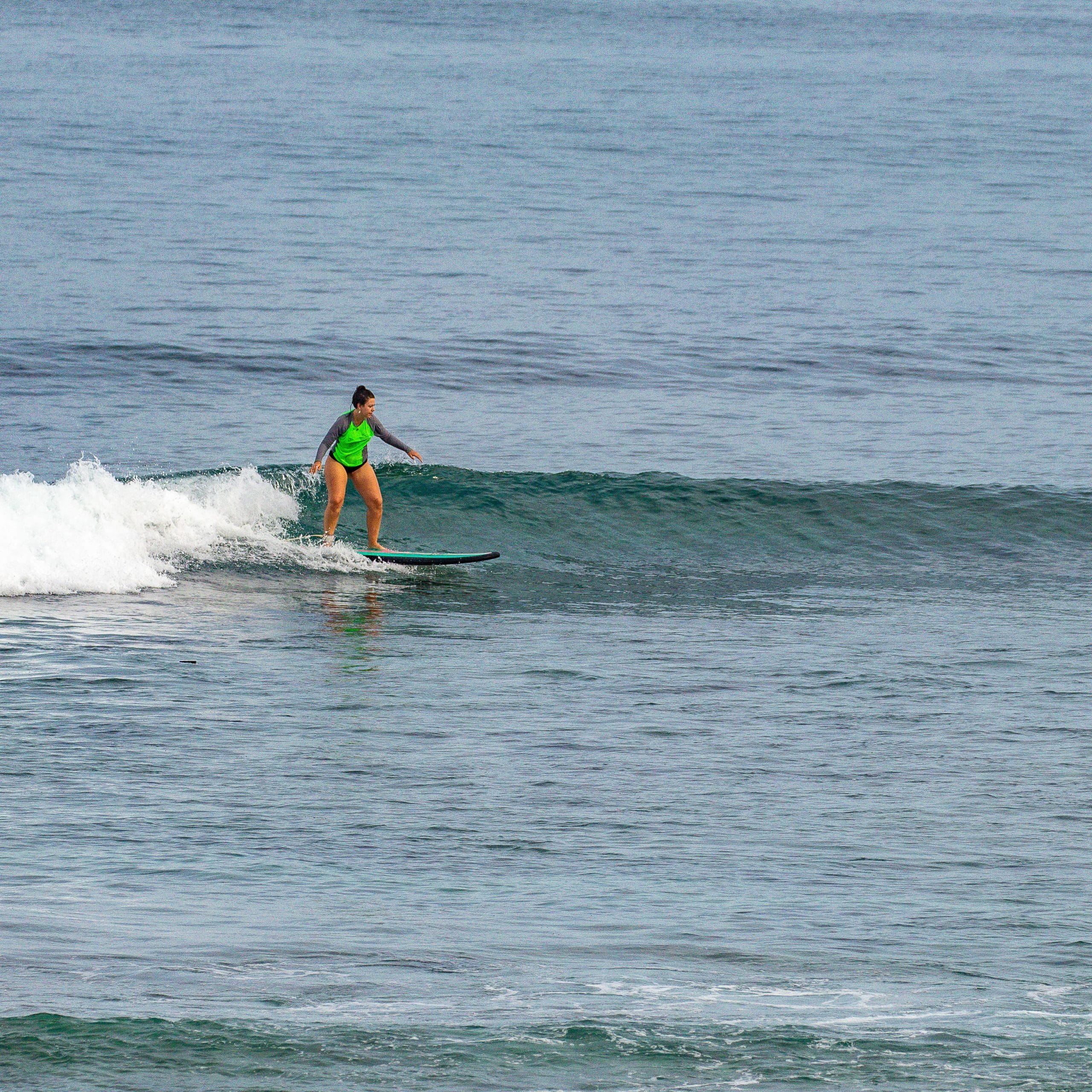 Surfer riding a wave at Padang.