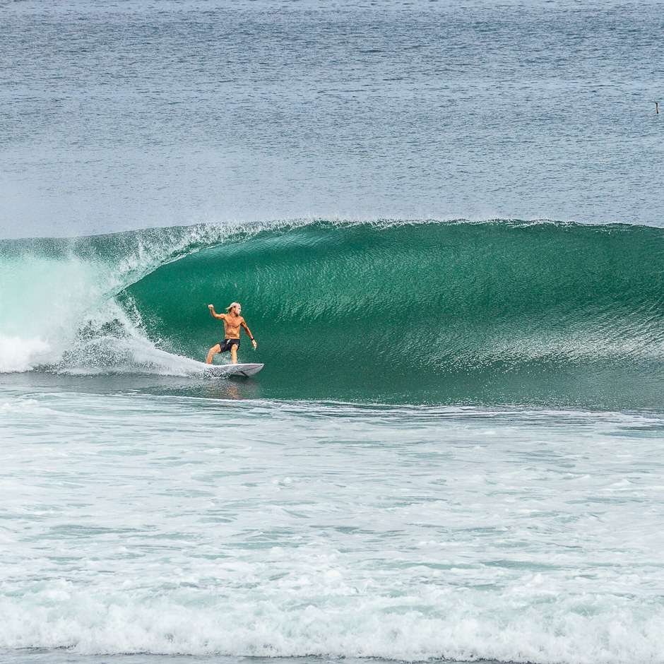 Surfer getting a barrel at Bingin.