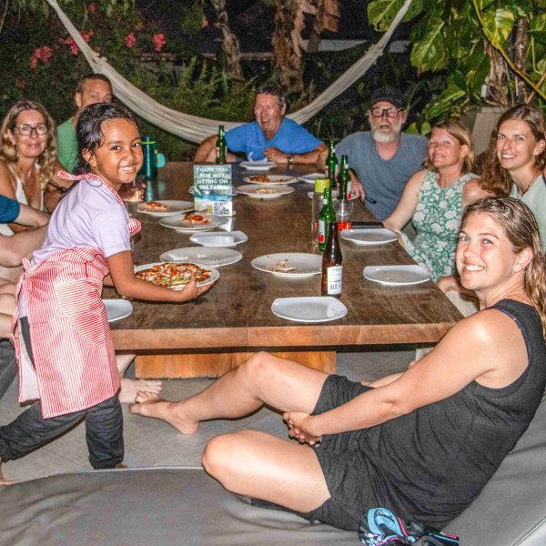 Farrah serving pizza
