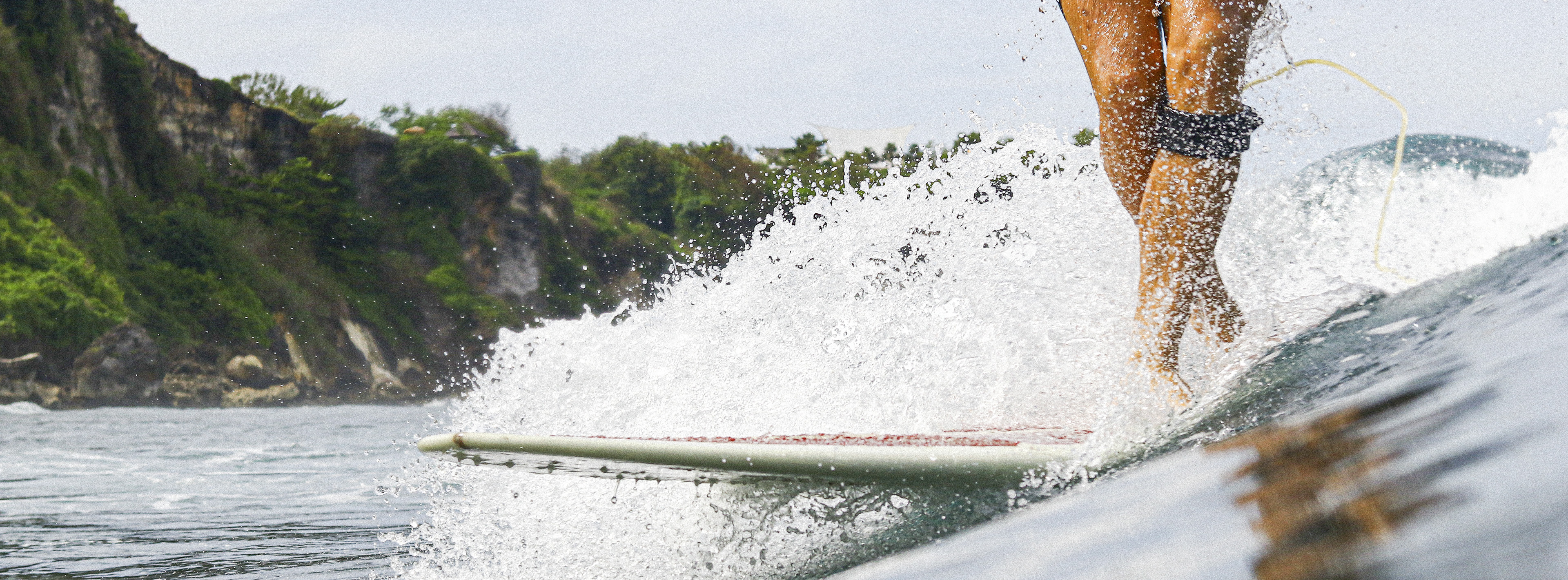 Surfer riding a wave.