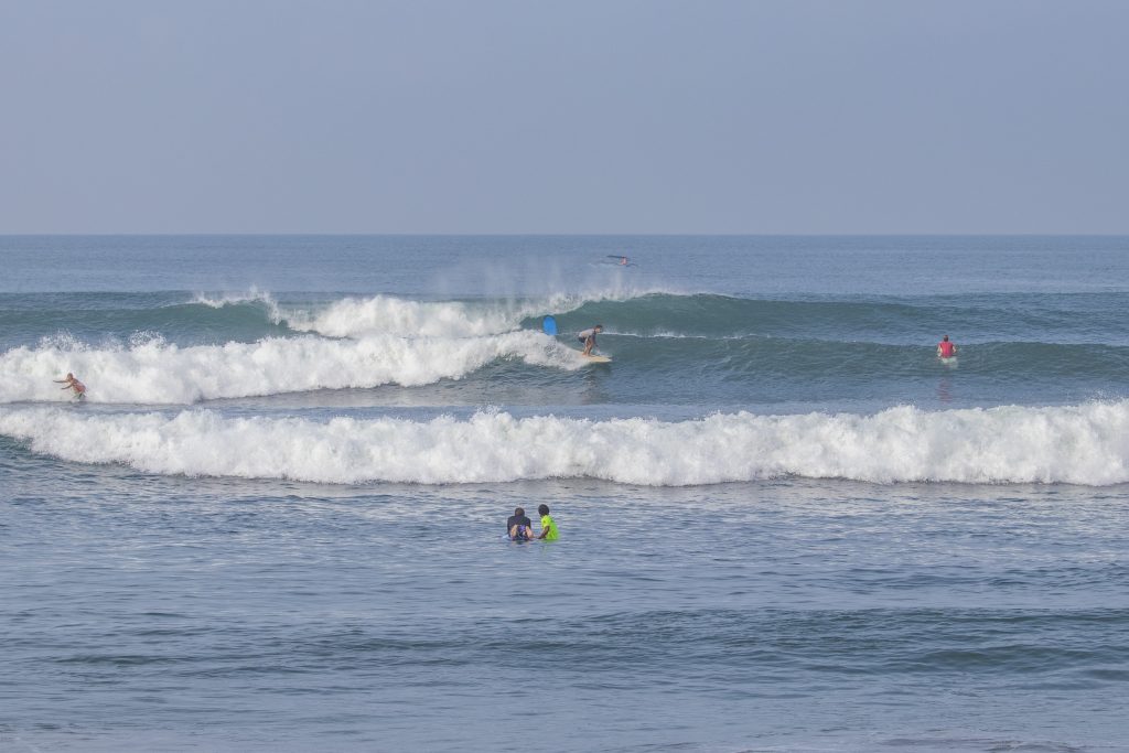 Surfer riding a wave at Batu Belong.