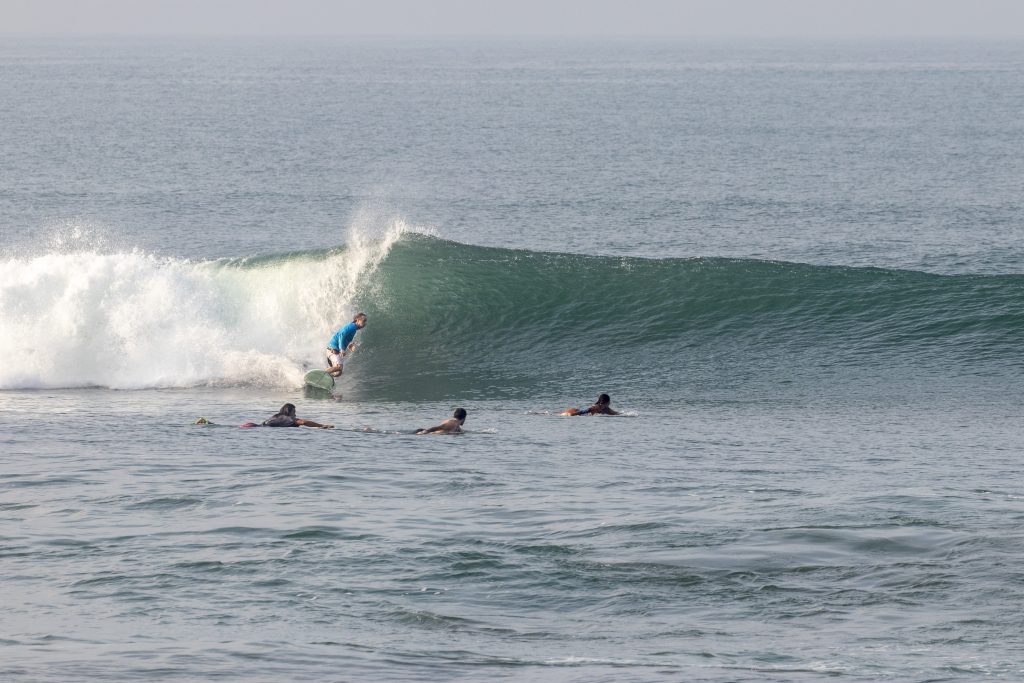 Surfer riding a wave at Echo left.