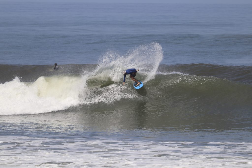 Surfer doing at turn at Balian