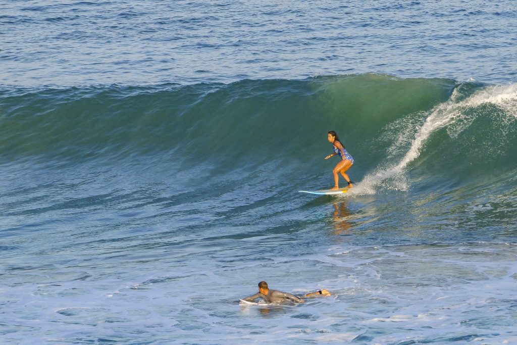 Female surfer riding Bingin rights