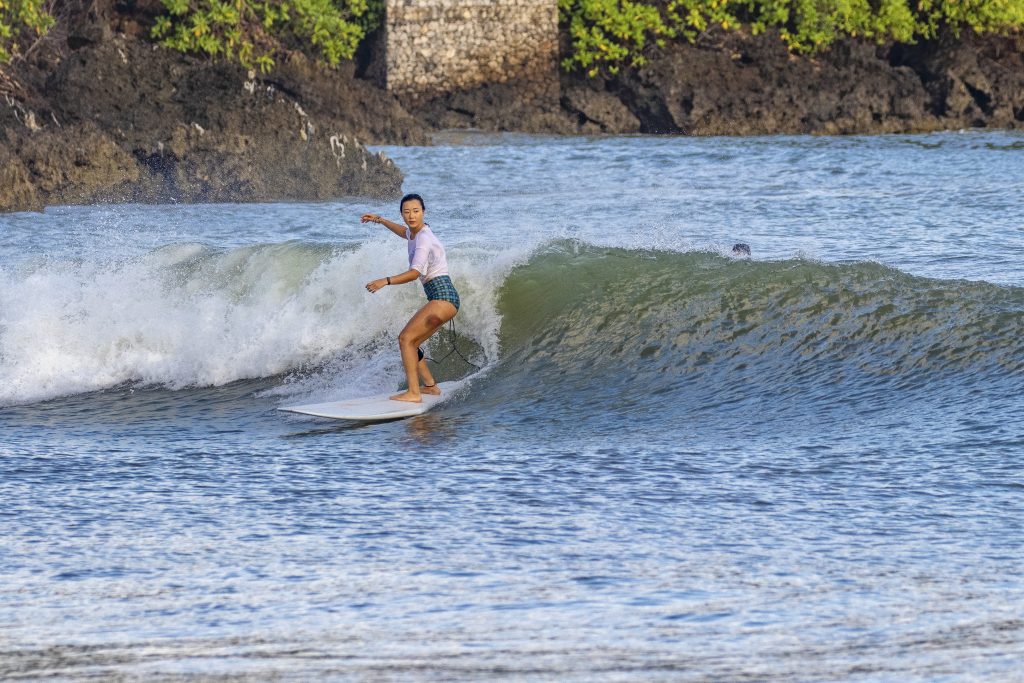 Girl on a fun wave at Jimbaran.