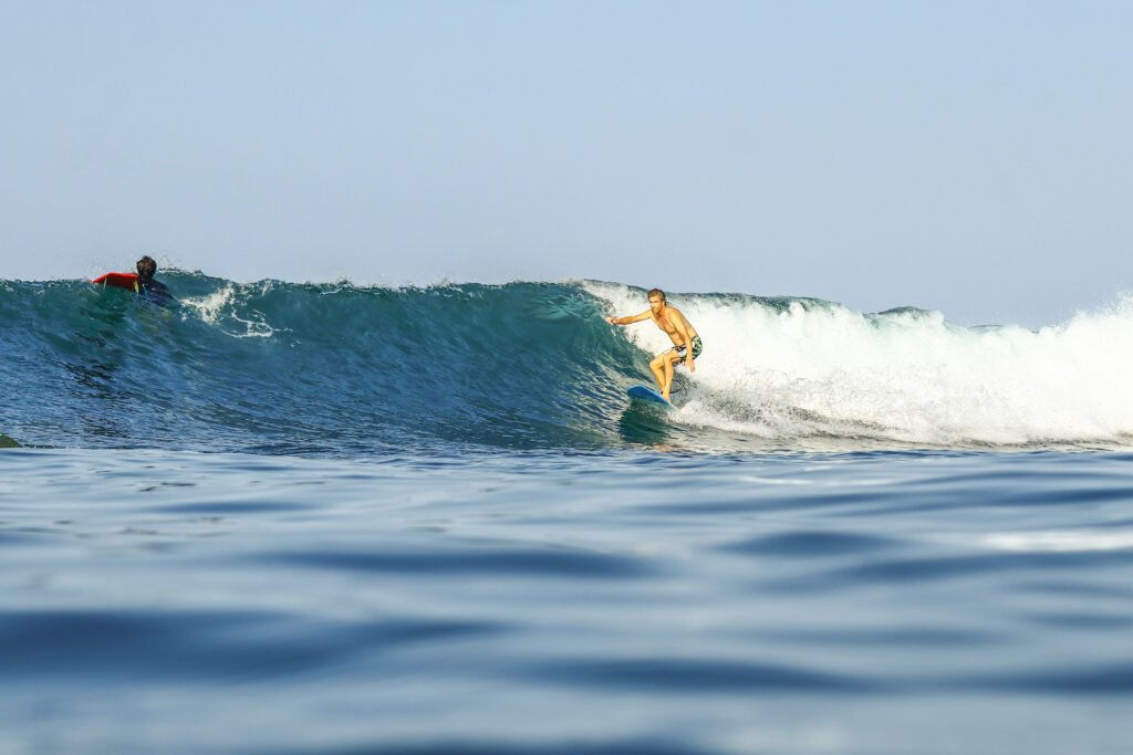 Surfing riding a clean wave at Airport Right on a small day.