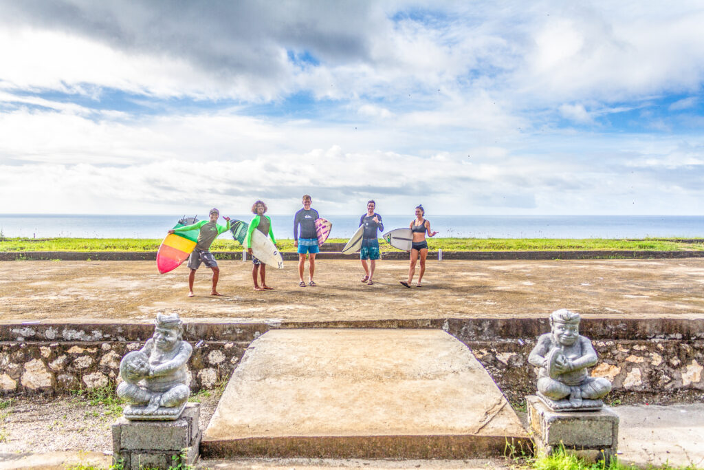 Surfers standing at the top of an abandoned cultural park.