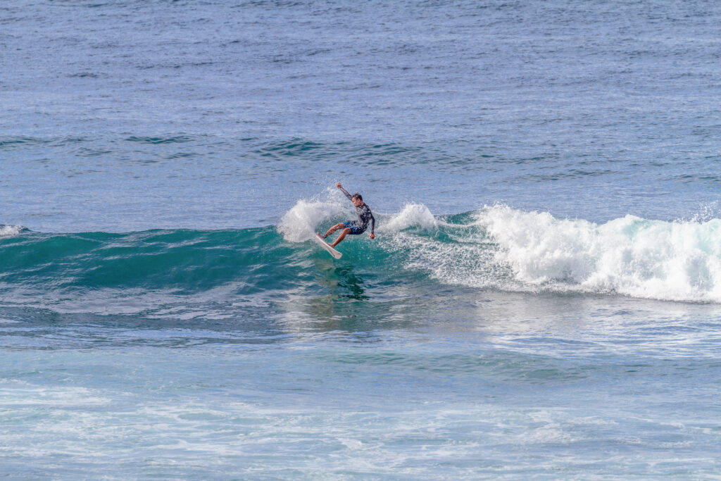 Surfer on his small right at Gunung Payung.