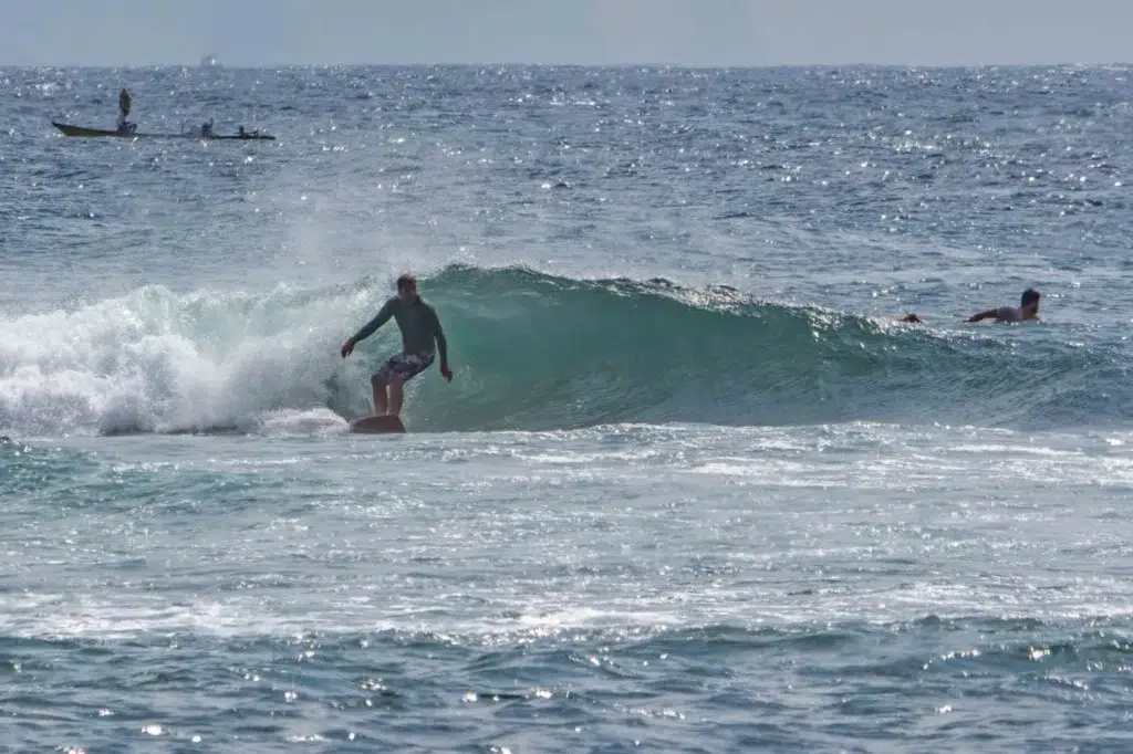 Surfer on a left at mengiat.
