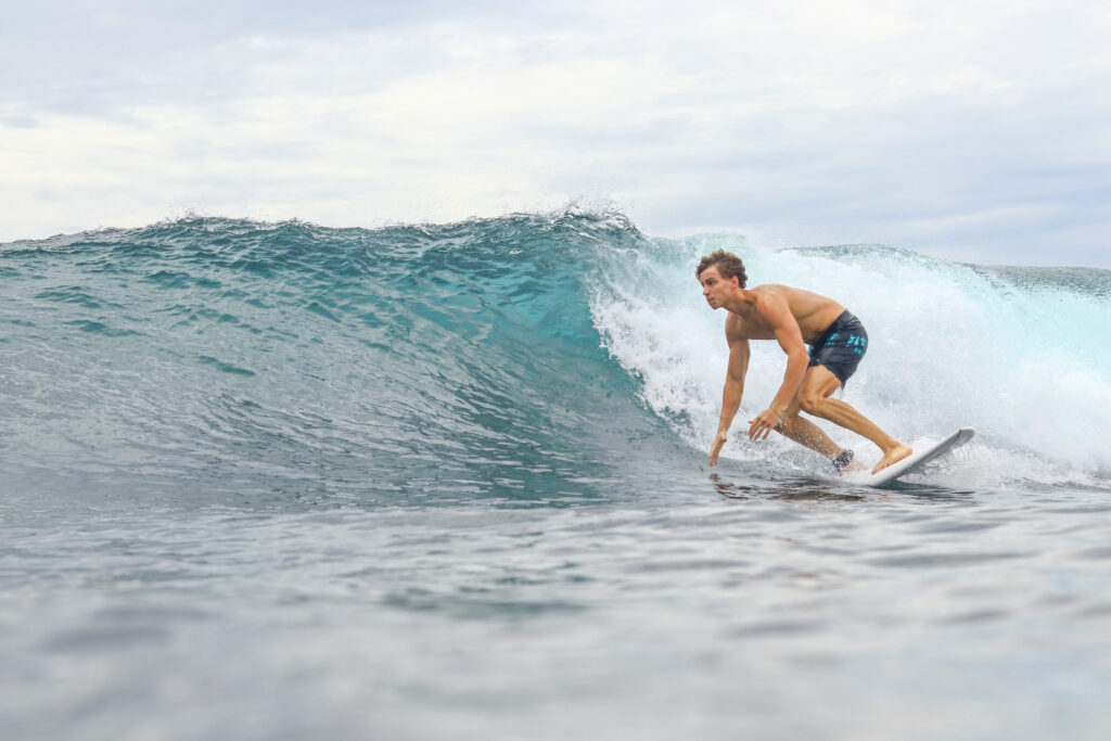 Surfer on a small wave at Mushroom Rock