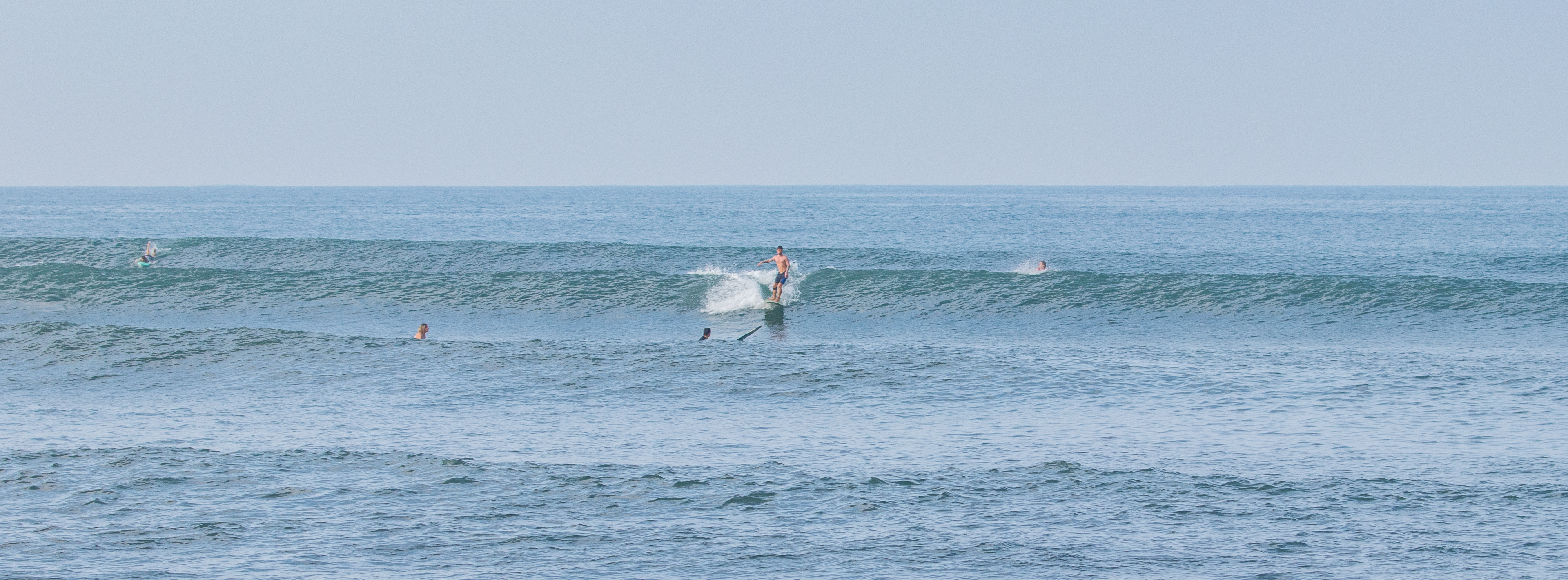 A surfer riding a wave at Old Man's