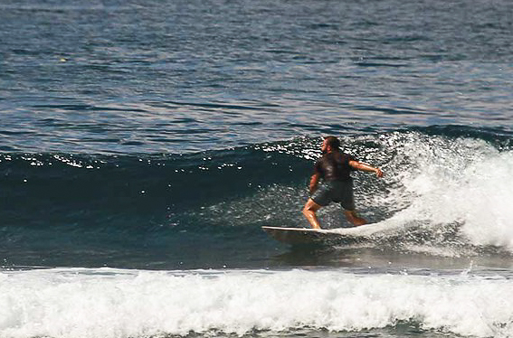 Surfer on a wave at Melasti.