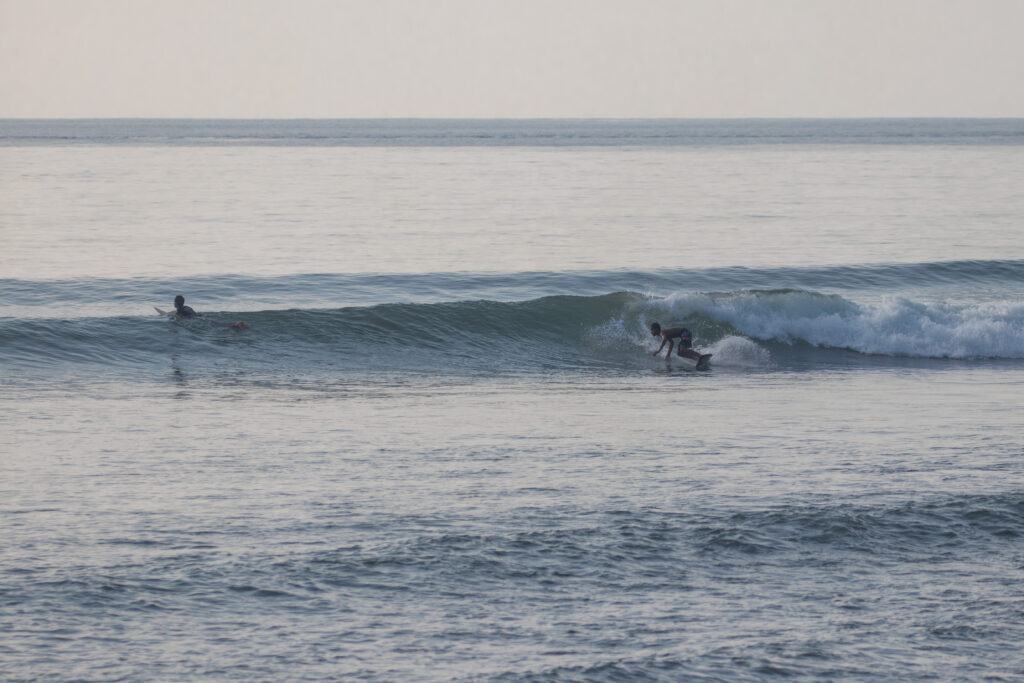 Local surfer on a small wave at Jasri.