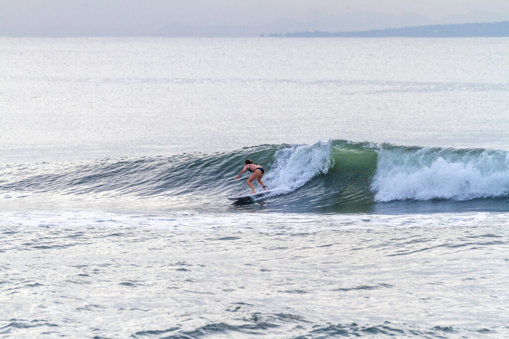 A surfer going right on a nicely shaped wave at KFC.