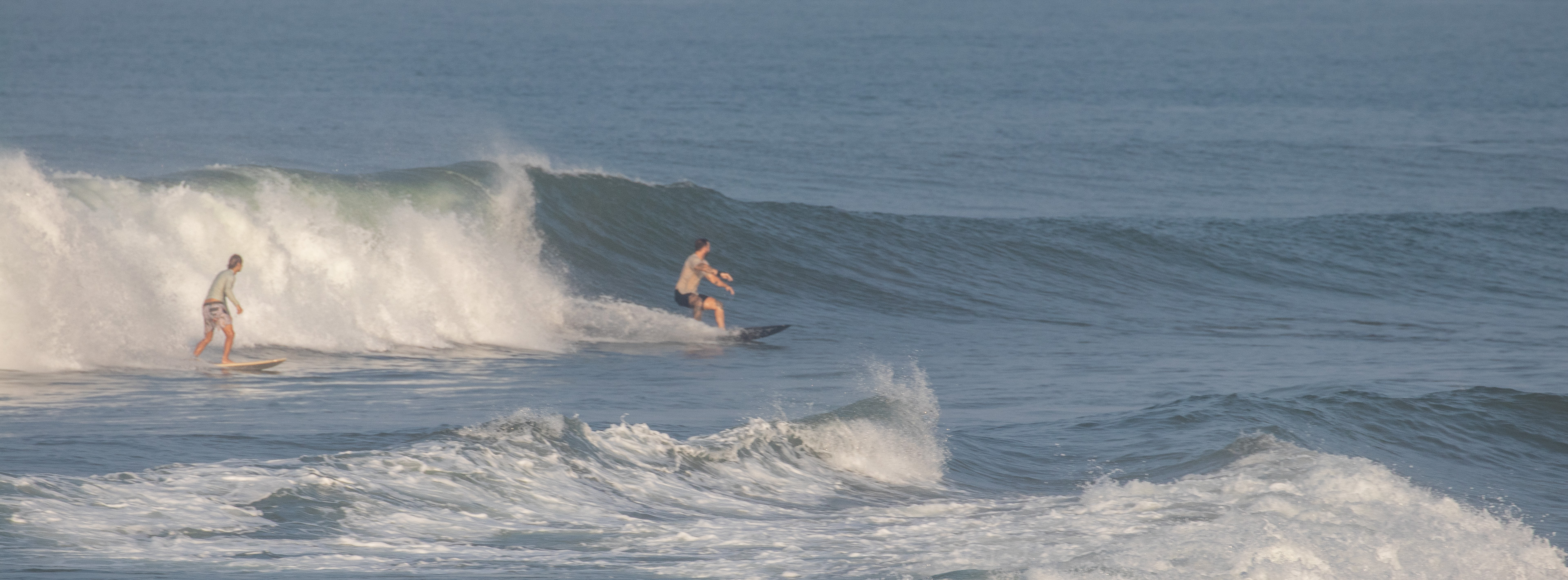 Surf riding a left at Pereranan
