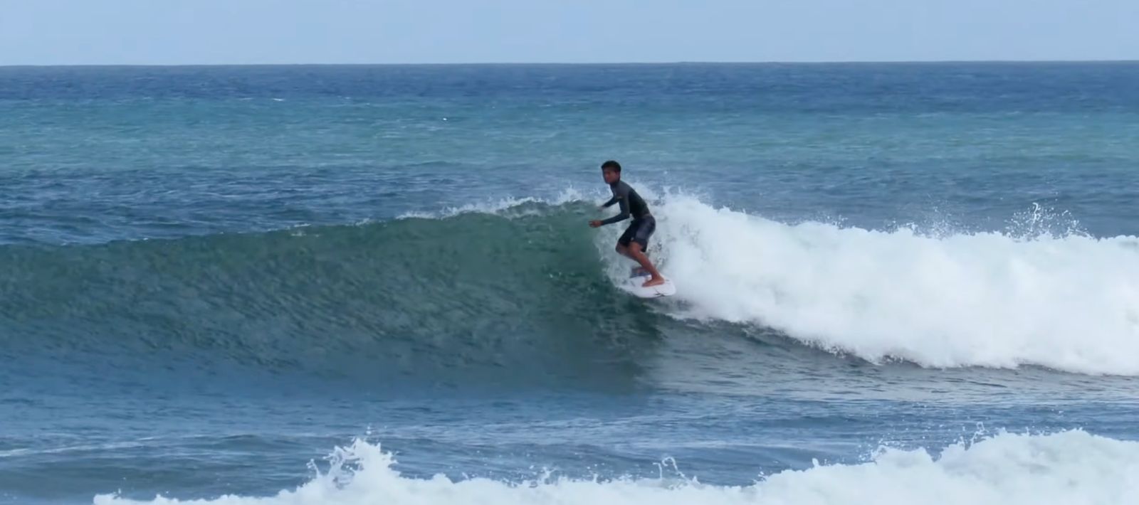 Surfer riding a right at Double Six.
