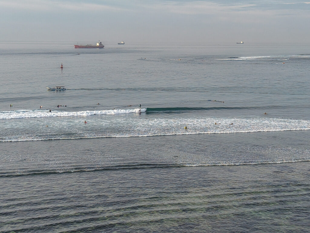 Surfers in the lineup at Baby Reef, Sanur