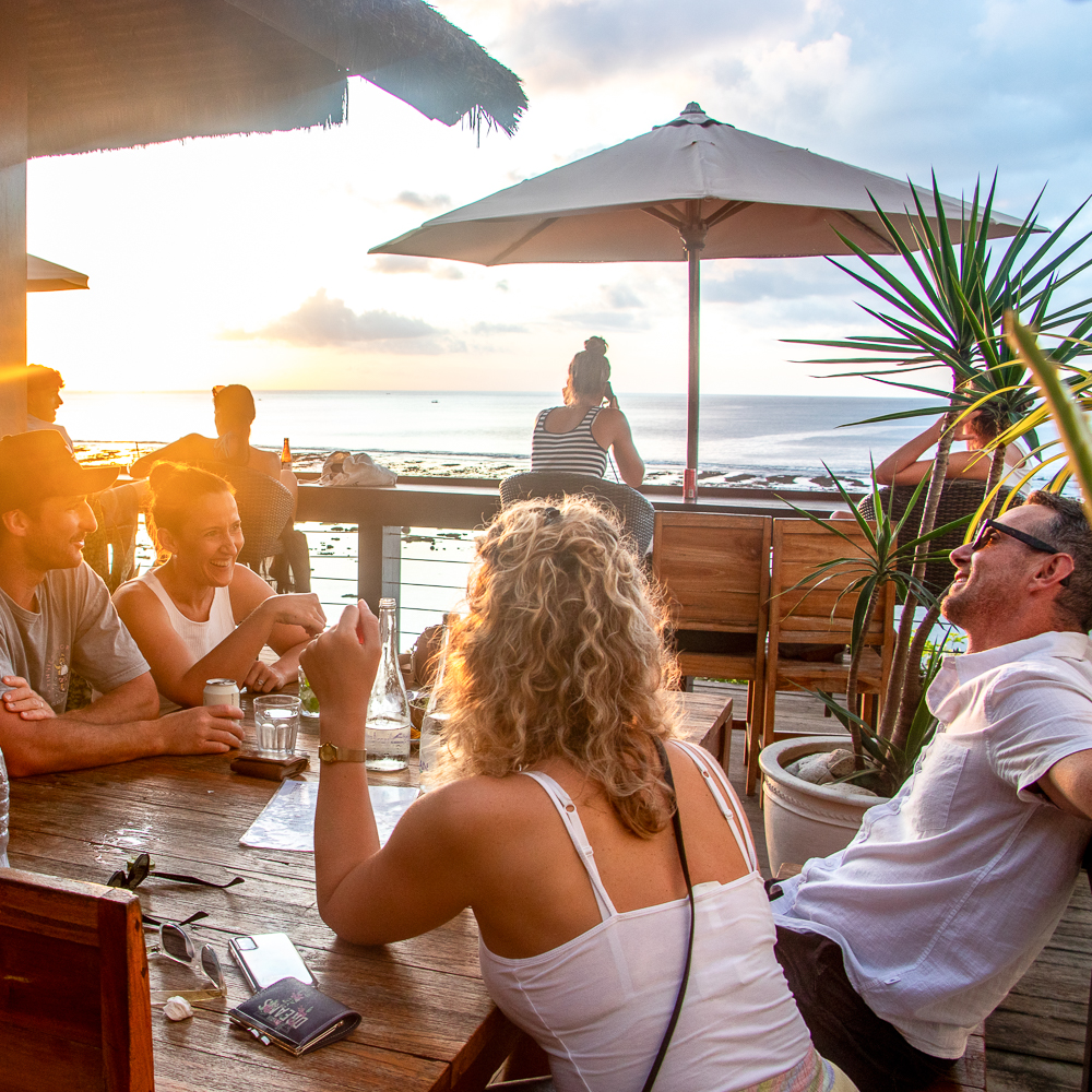 Group enjoying a sunset at Bingin.